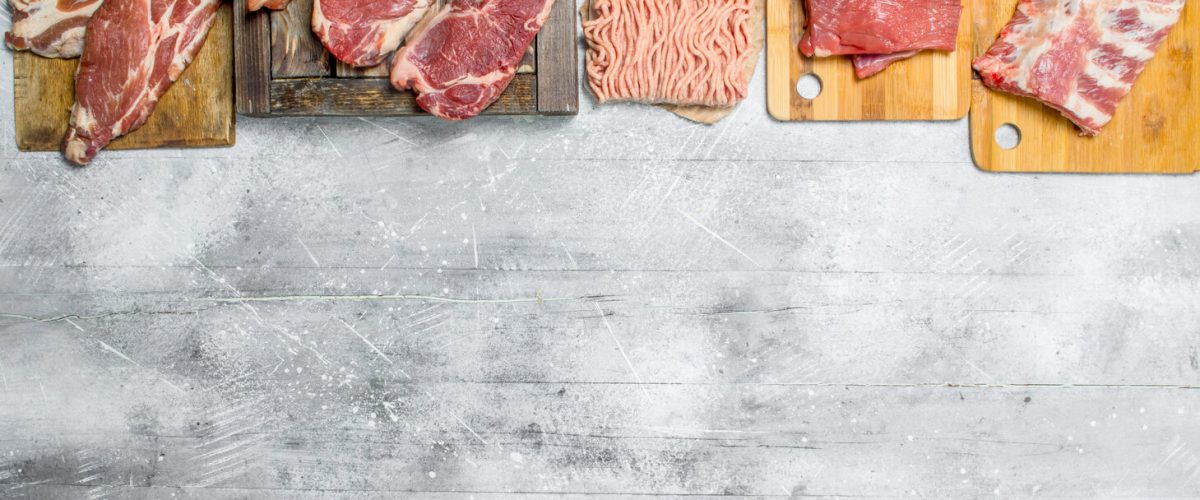 Raw meat. The various meats of pork and beef. On a rustic background.